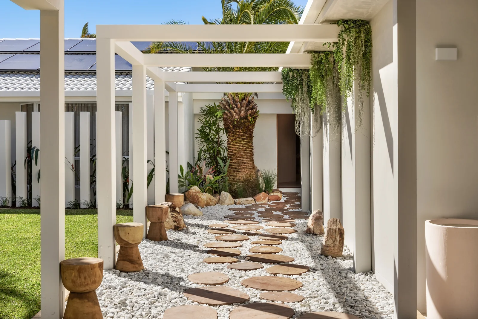 Stone Colonnade. Side path of a Gold Coast residence by SunnyDay Development.