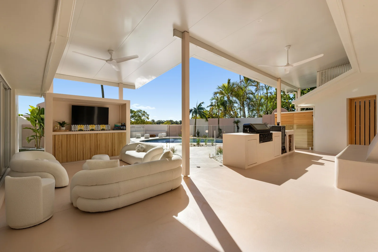 Pool Terrace. Entertainment and barbecue area of a Gold Coast residence by SunnyDay Development.