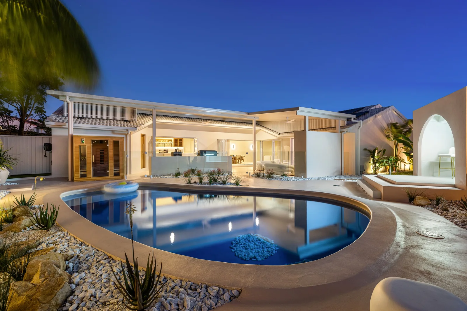 Twilight Pool Court. Entertainment and barbecue area of a Gold Coast residence by SunnyDay Development.