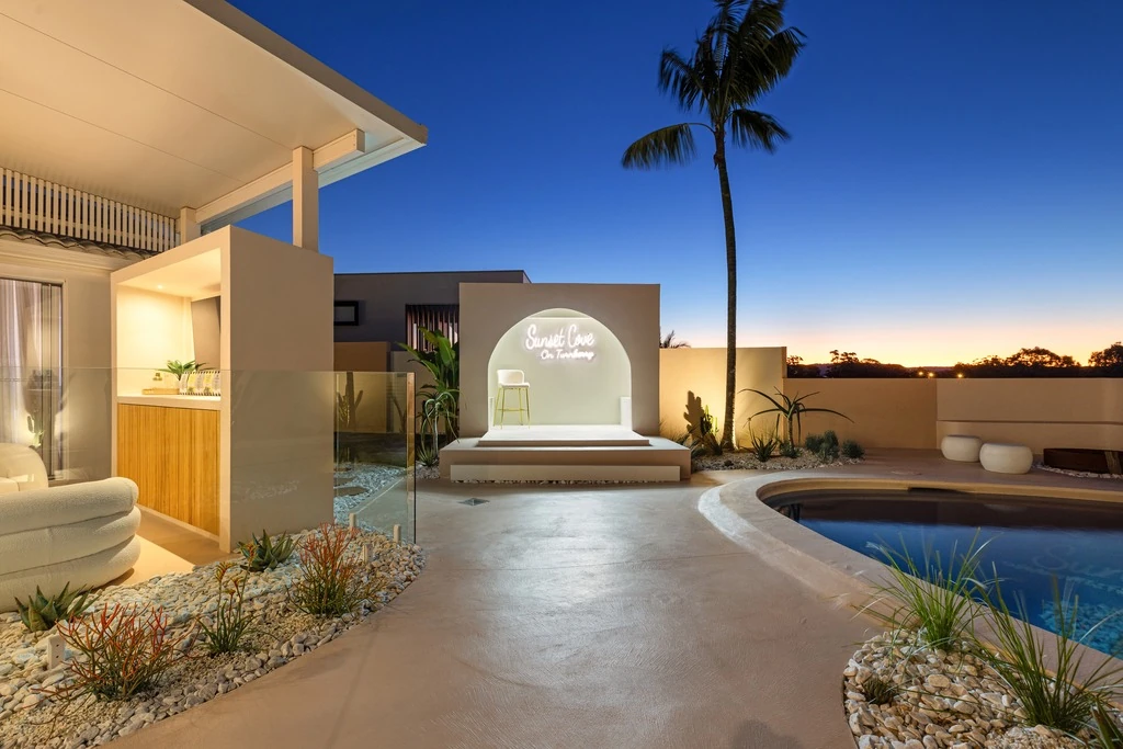 Twilight pool court of a Gold Coast residence by SunnyDay Development